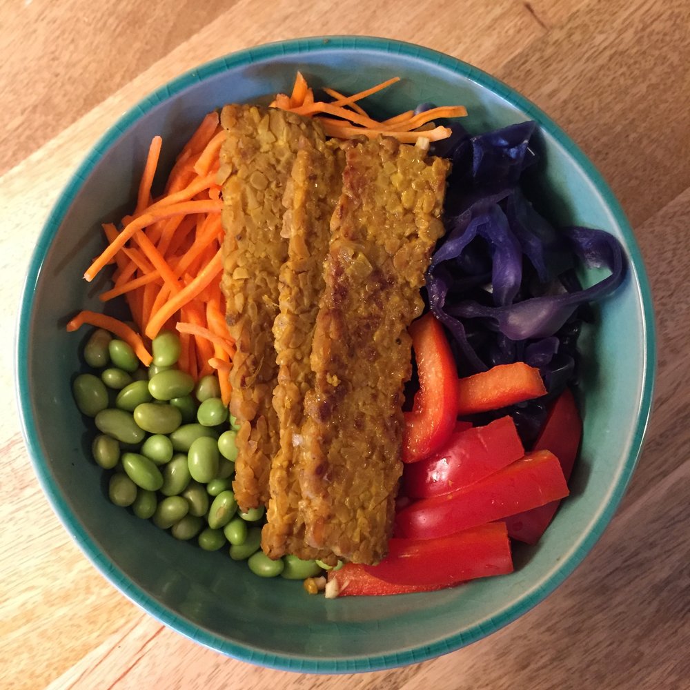 Orange Maple Tempeh (see June blog for recipe) on brown rice with edamame, red peppers, purple cabbage and shredded carrots